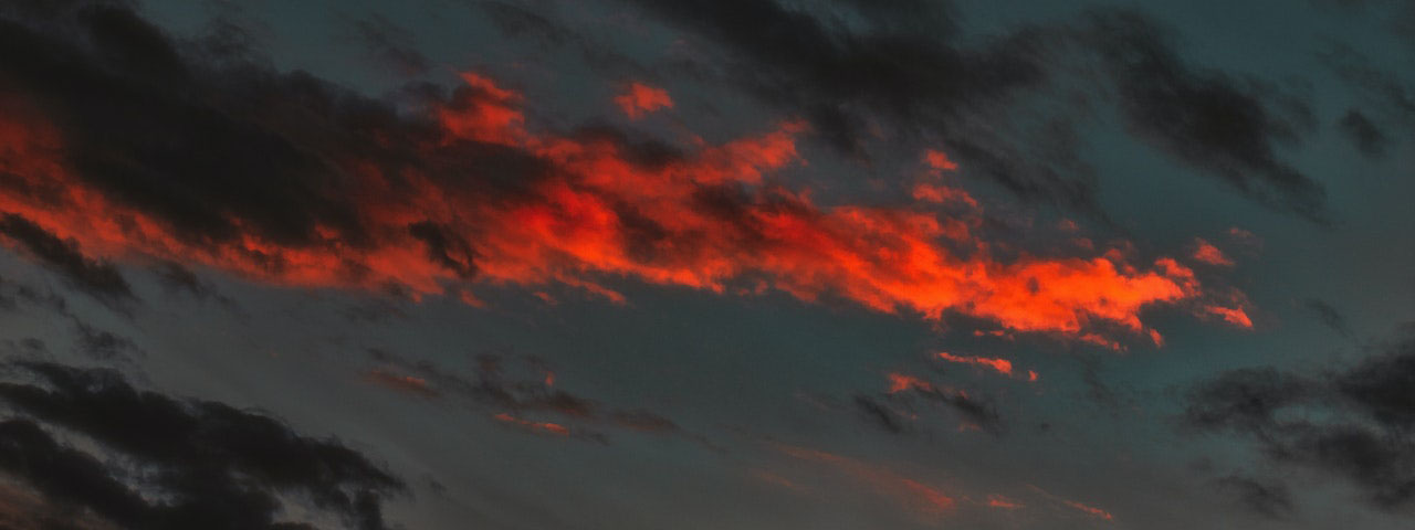 black and orange colored clouds