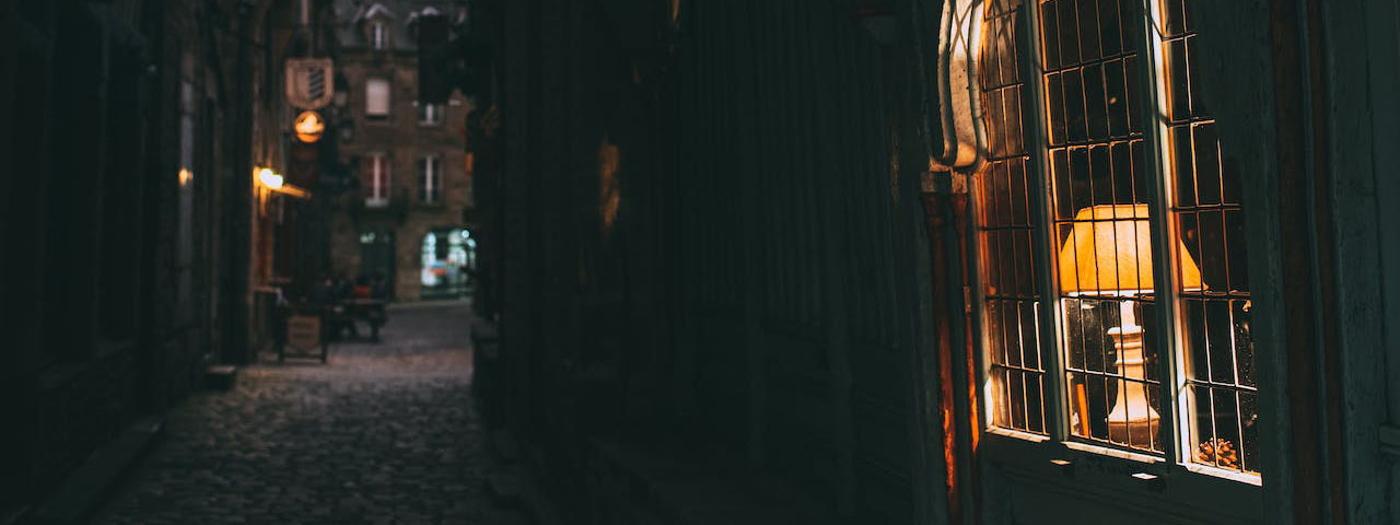 Narrow street with residential houses in late evening