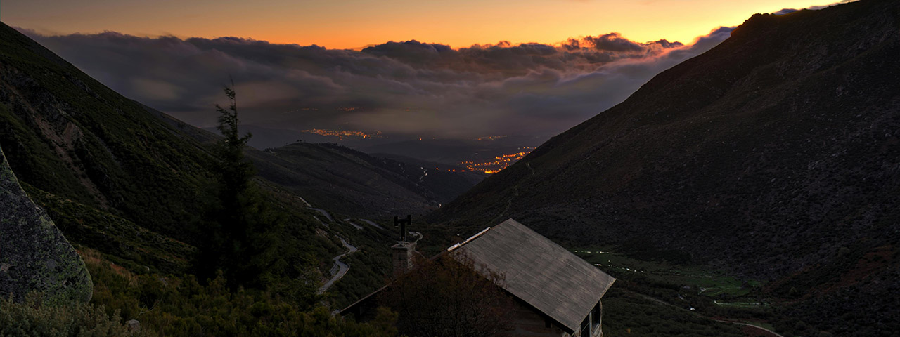 Cobblestone House on a Hill Under Evening Sky