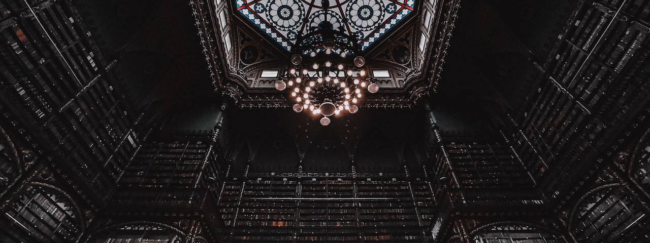 Royal Portuguese Cabinet of Reading with chandelier on ornamental ceiling
