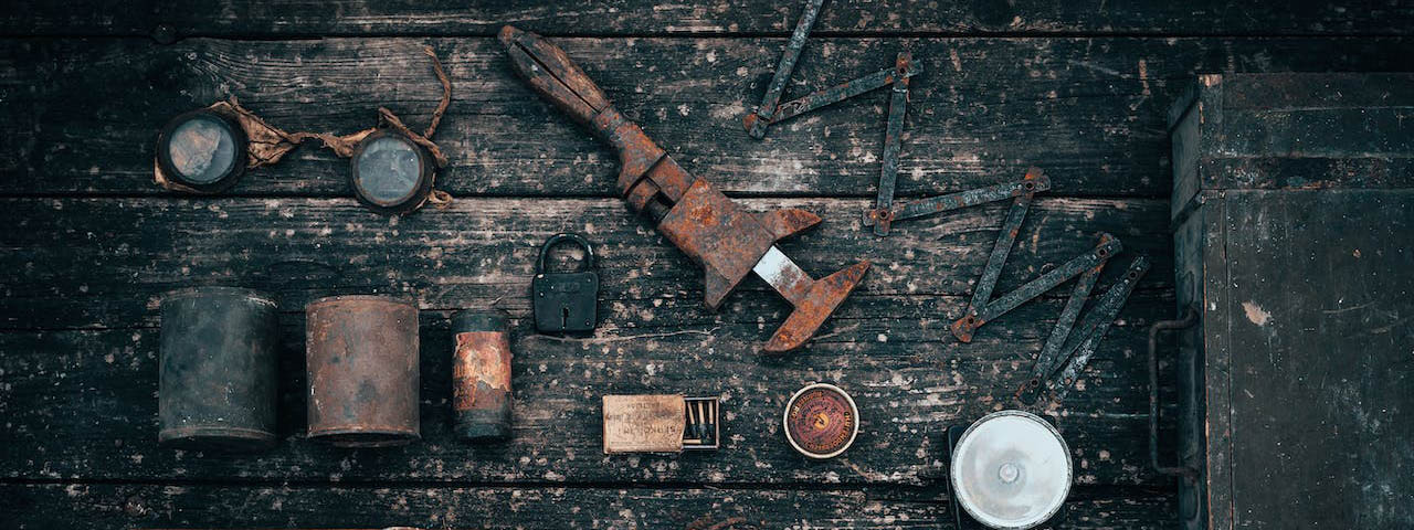 Old tools on wooden surface
