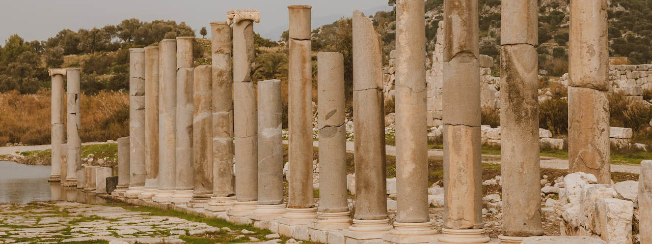 Brown Concrete Pillars Lined Up